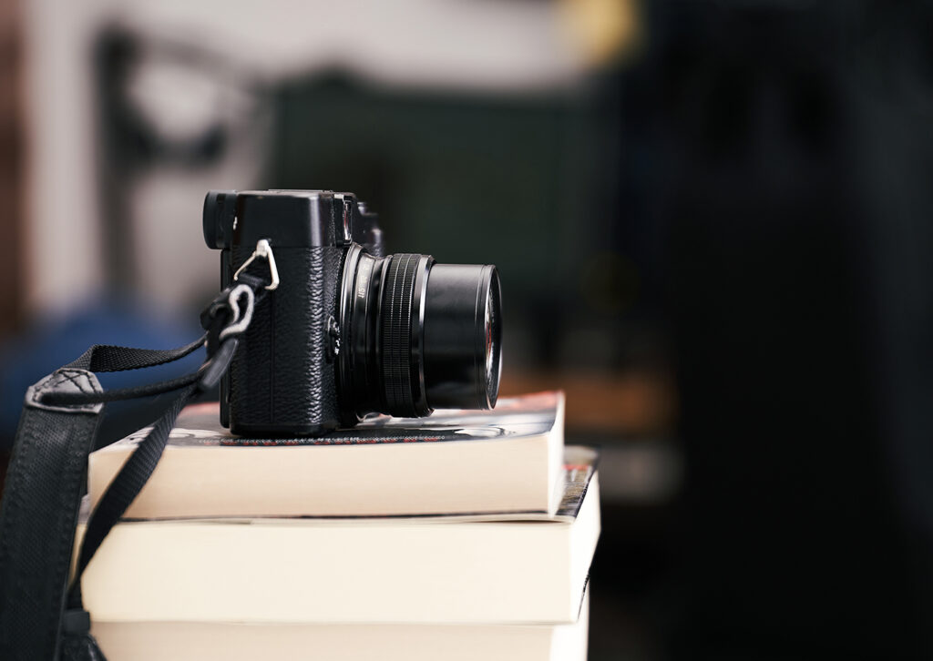 Camera sitting on books