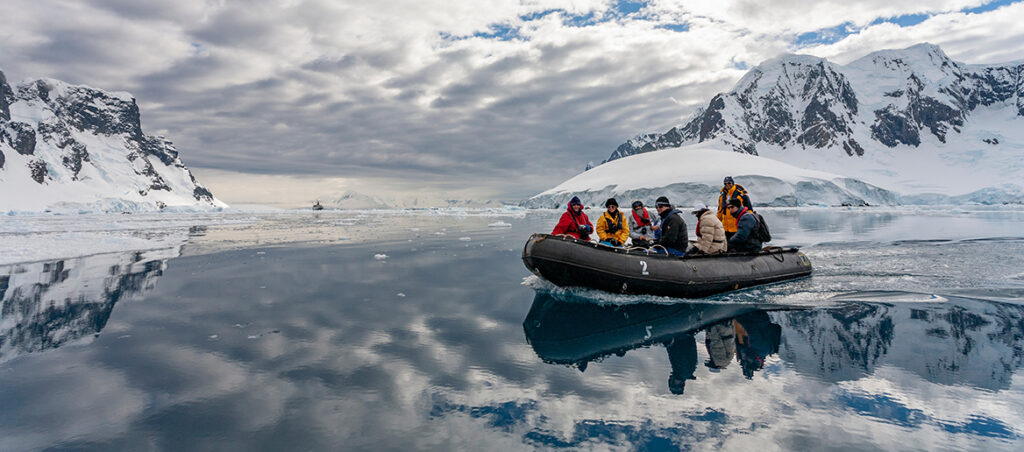 Antarctica. Adventure tourists in Pleneau Bay in the Lamaire Channel in Antarctica.
