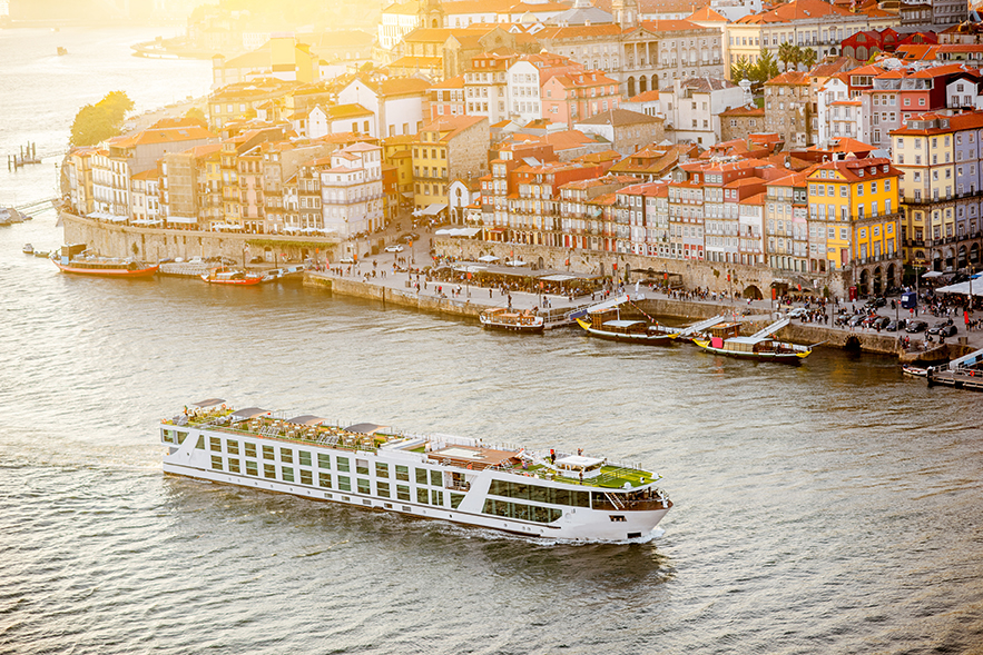 Aerial landscape view on the Douro river and old town of Porto during the sunset in Portugal