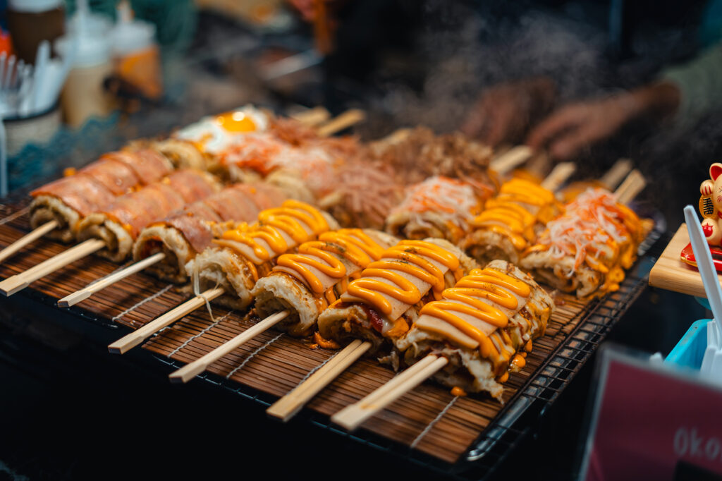 Japanese rice rolls on skewers, street food