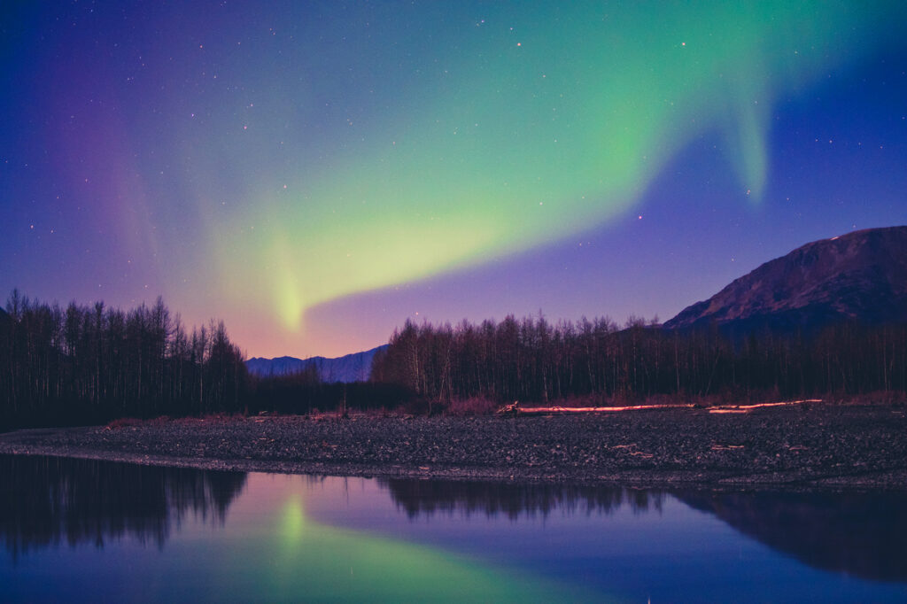 Northern lights with reflection in a lake